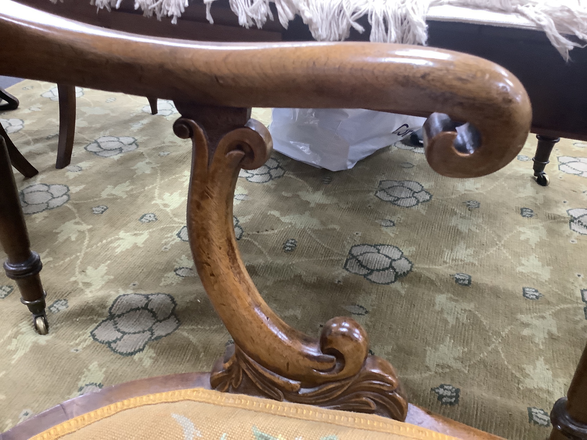A Victorian carved walnut elbow chair, width 58cm, depth 48cm, height 90cm